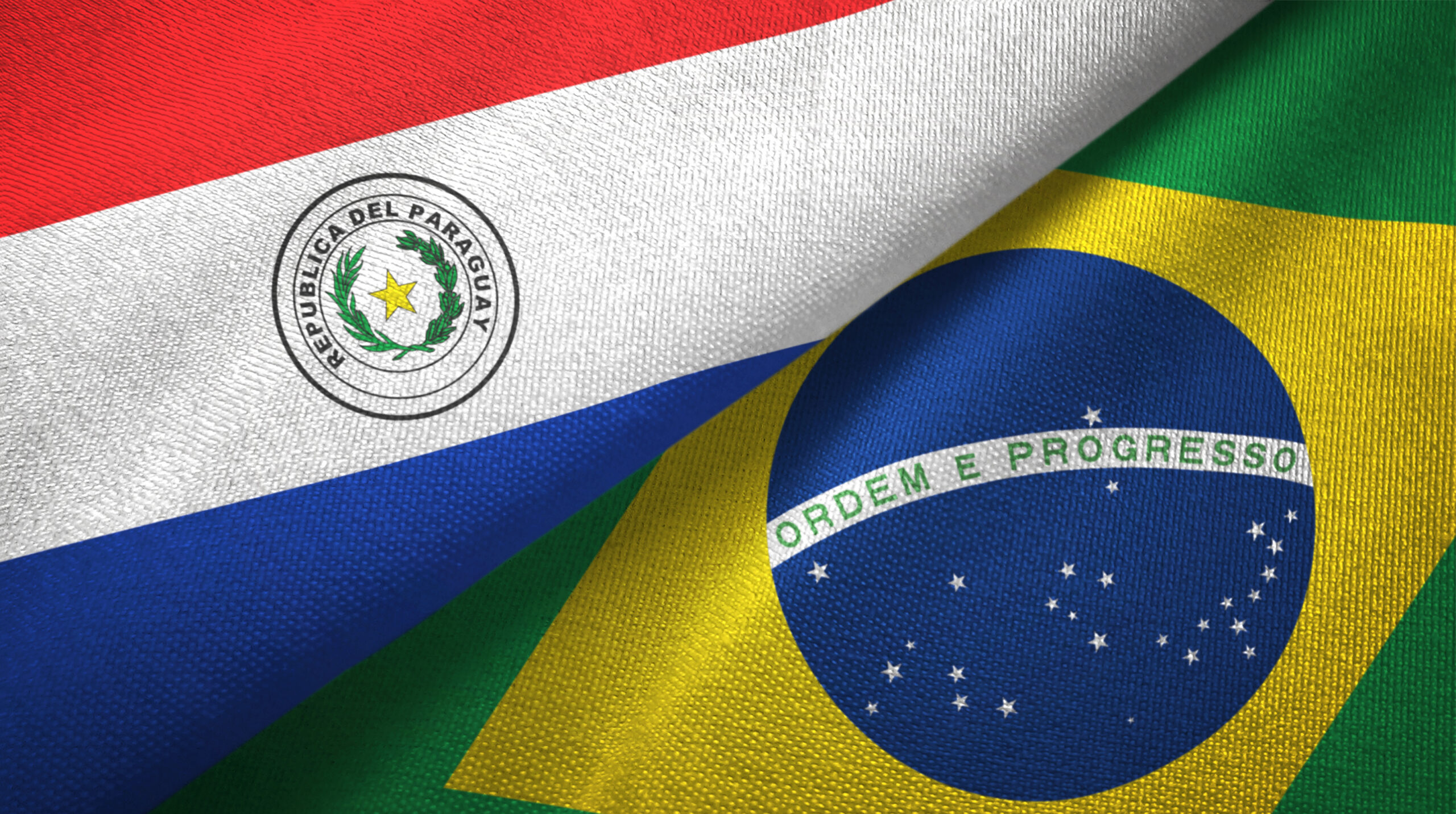 Paraguay and Brazil two flags textile cloth, fabric texture